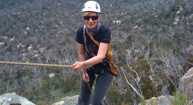 Fiona abseiling at Booroomba Rocks